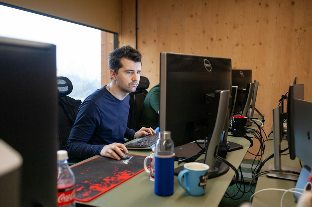 insurance programmer at desk
