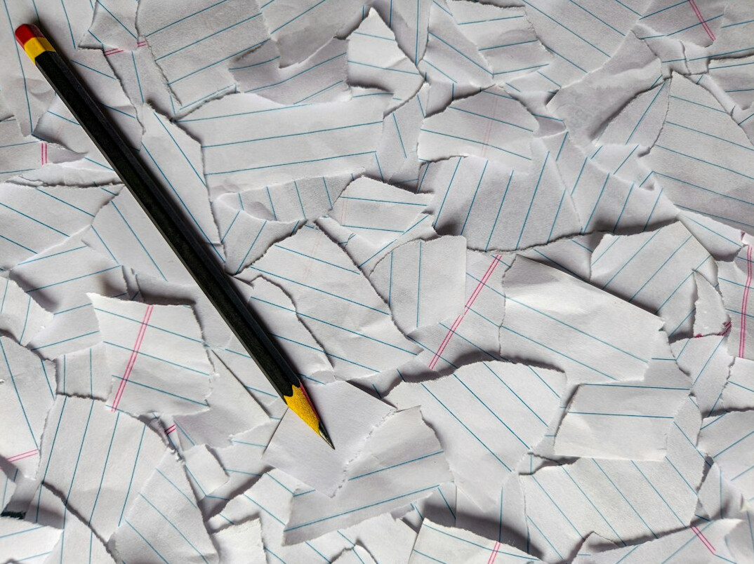 Stack of documents and a pen on an office desk